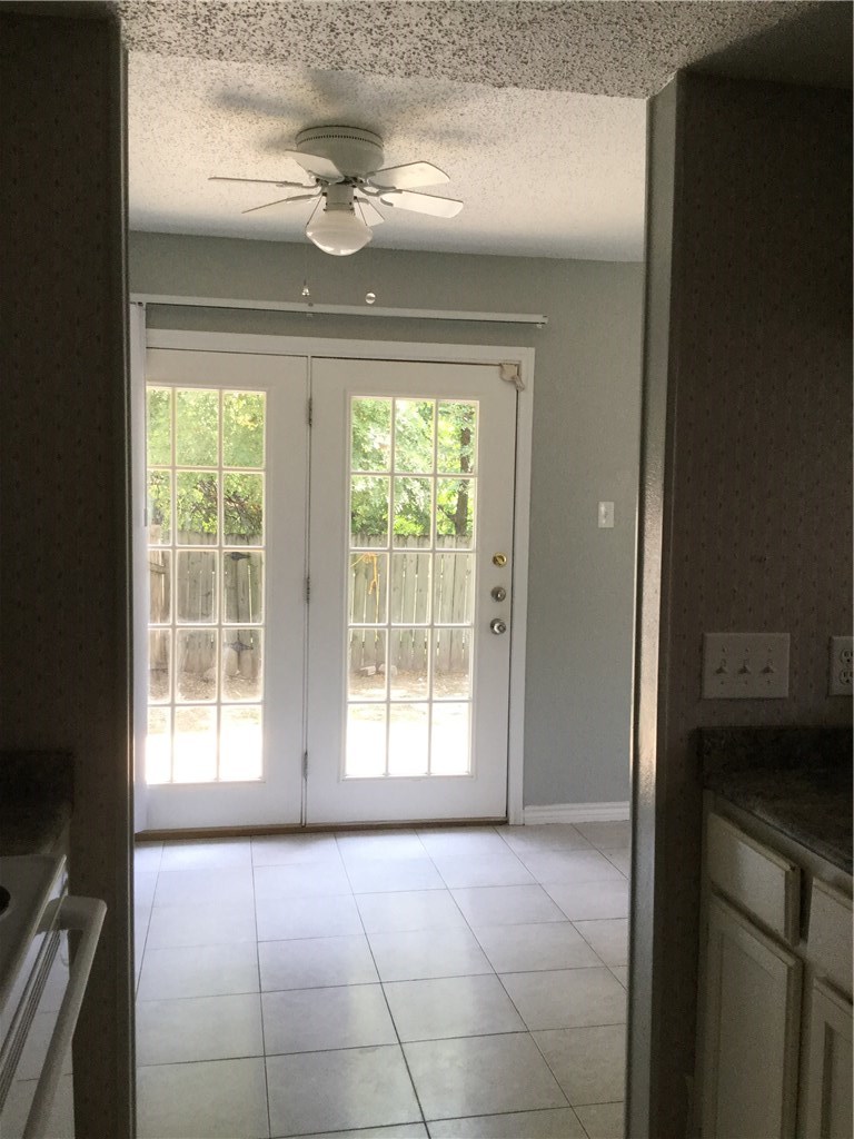 13409 Saddlebrook Trail, Unit A Austin, TX 78729 - Photo 4 of 21 a view of an empty room with a window