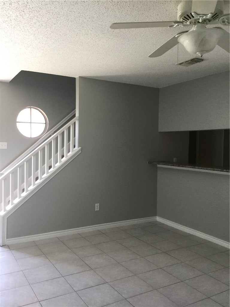 13409 Saddlebrook Trail, Unit A Austin, TX 78729 - Photo 5 of 21 a view of staircase with white walls