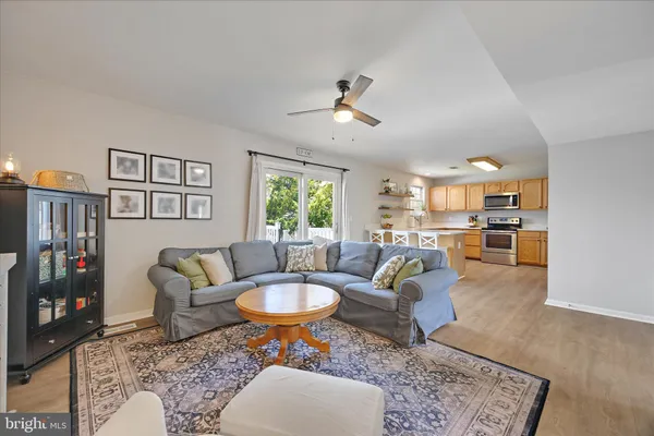 a living room with furniture and a rug