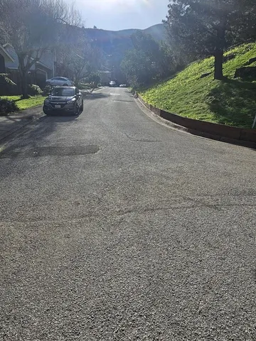 a view of a yard with car parked
