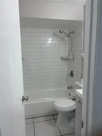 a bathroom with a toilet a sink and a shower