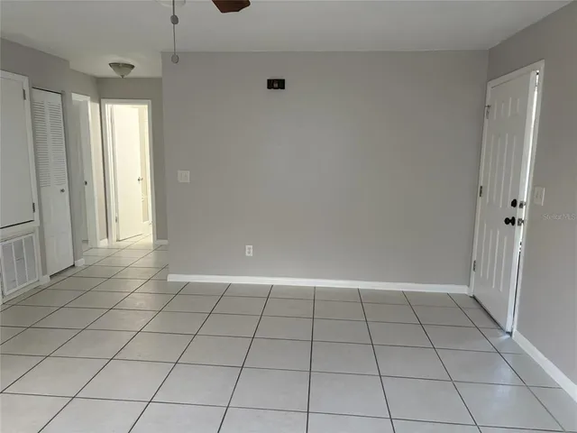 a view of an empty room and window