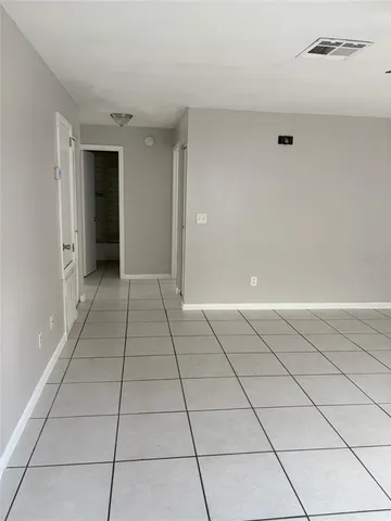 a view of a livingroom with white doors