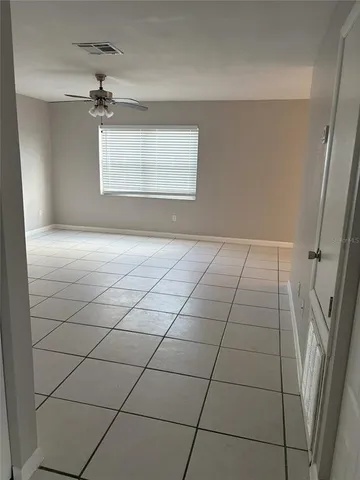 a view of an empty room with a window