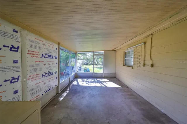 a view of an empty room and window