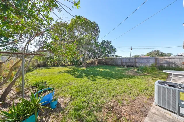 a view of a garden with plants and a lake view