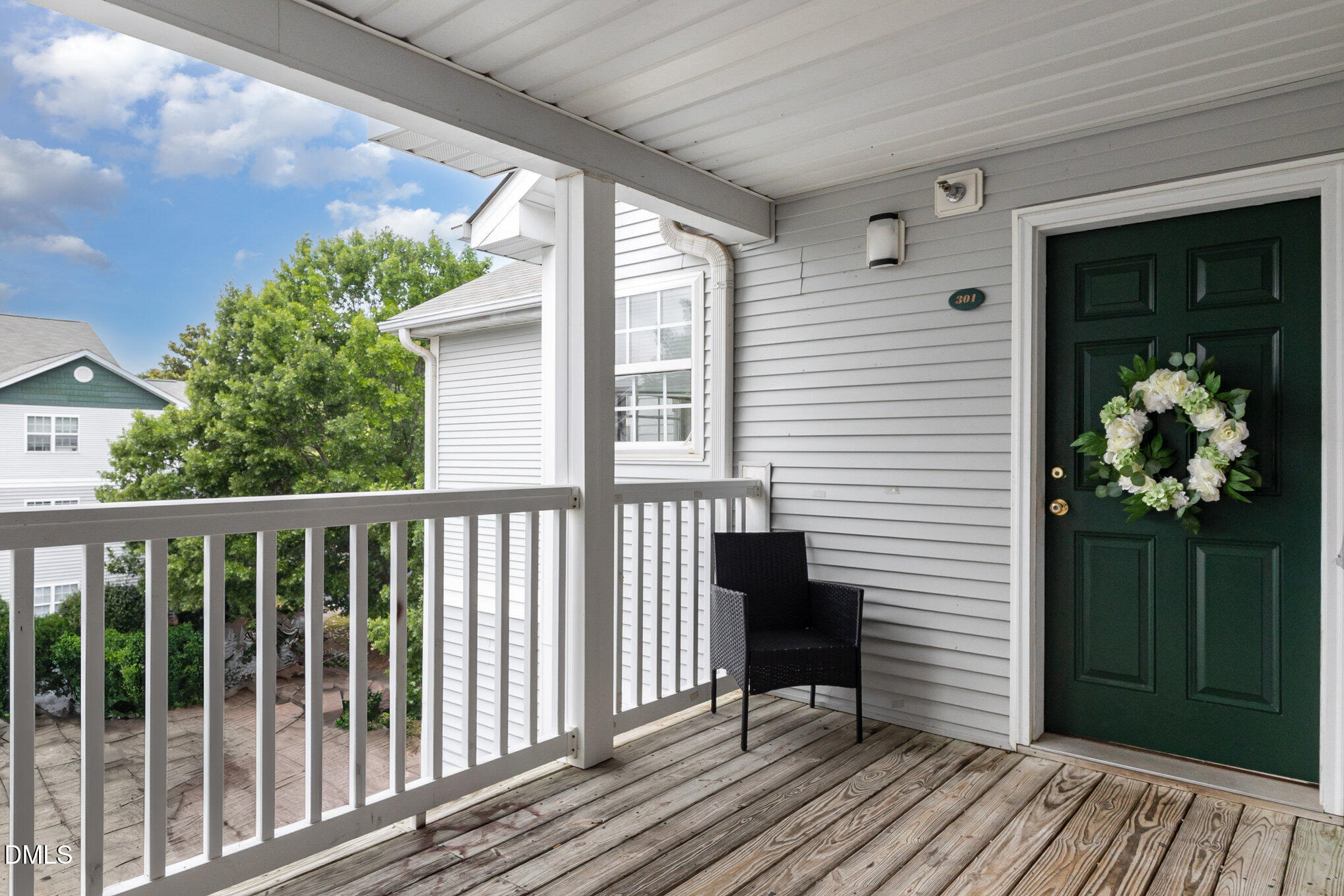 a view of a balcony with wooden floor