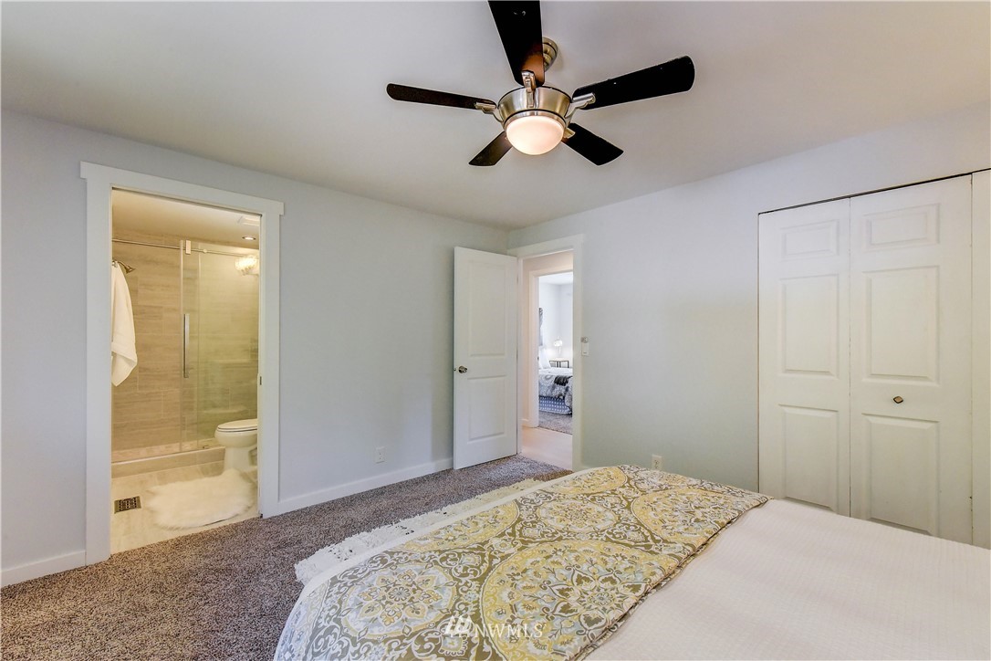 21828 Meridian Avenue South Bothell, WA 98021 - Photo 15 of 31 a bedroom with a bed and a dresser