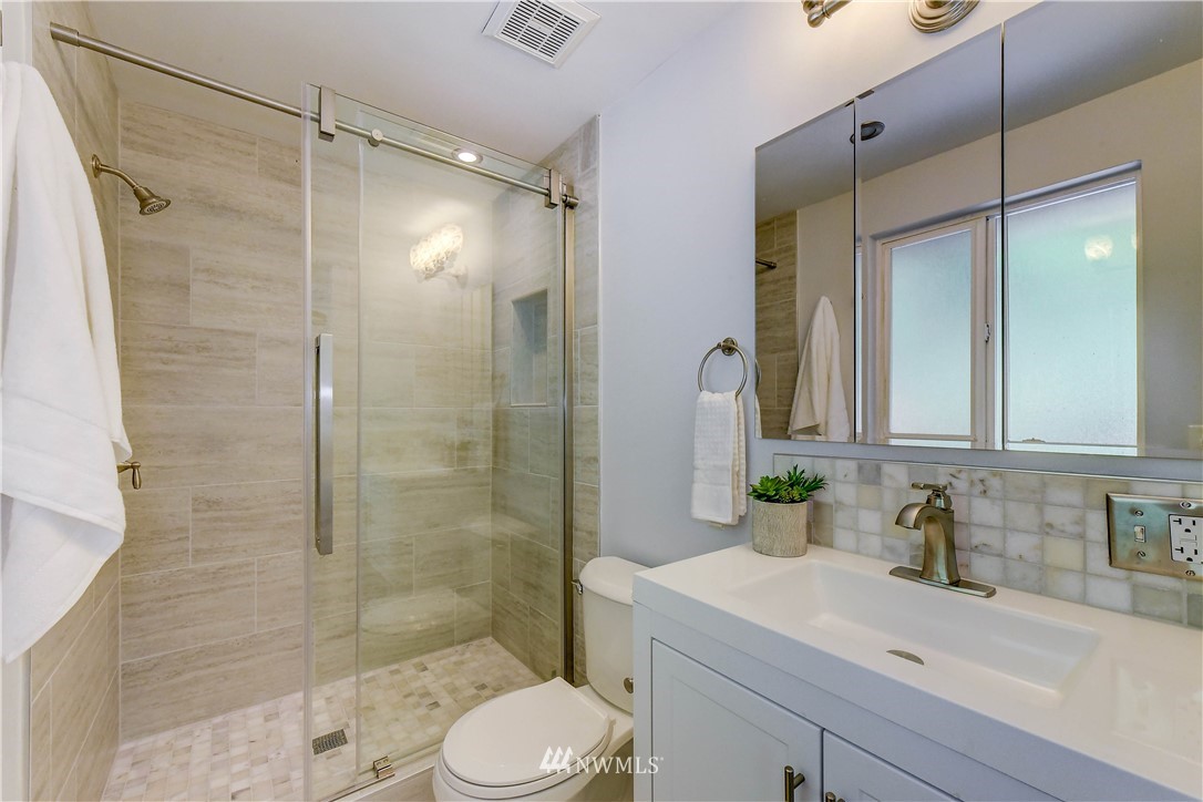 21828 Meridian Avenue South Bothell, WA 98021 - Photo 16 of 31 a bathroom with a sink a toilet and shower