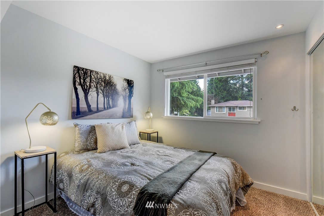 21828 Meridian Avenue South Bothell, WA 98021 - Photo 18 of 31 a bedroom with a bed and a painting on the wall