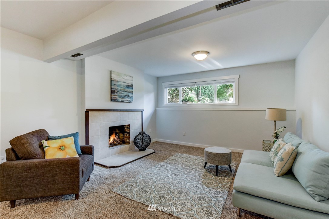 21828 Meridian Avenue South Bothell, WA 98021 - Photo 20 of 31 a living room with furniture and a fireplace