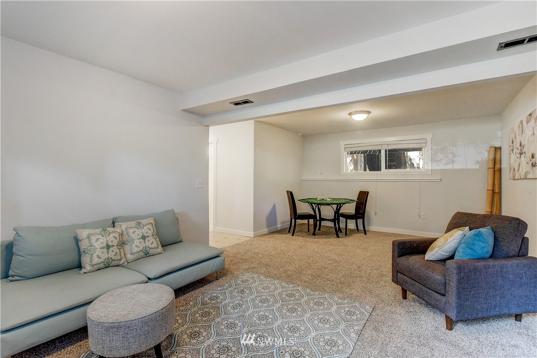 21828 Meridian Avenue South Bothell, WA 98021 - Photo 22 of 31 a living room with furniture and a couch