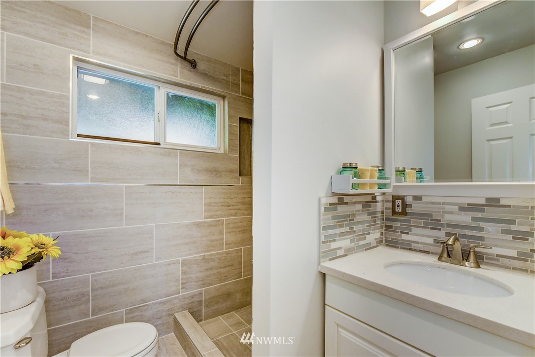 21828 Meridian Avenue South Bothell, WA 98021 - Photo 26 of 31 a bathroom with a sink toilet and a mirror