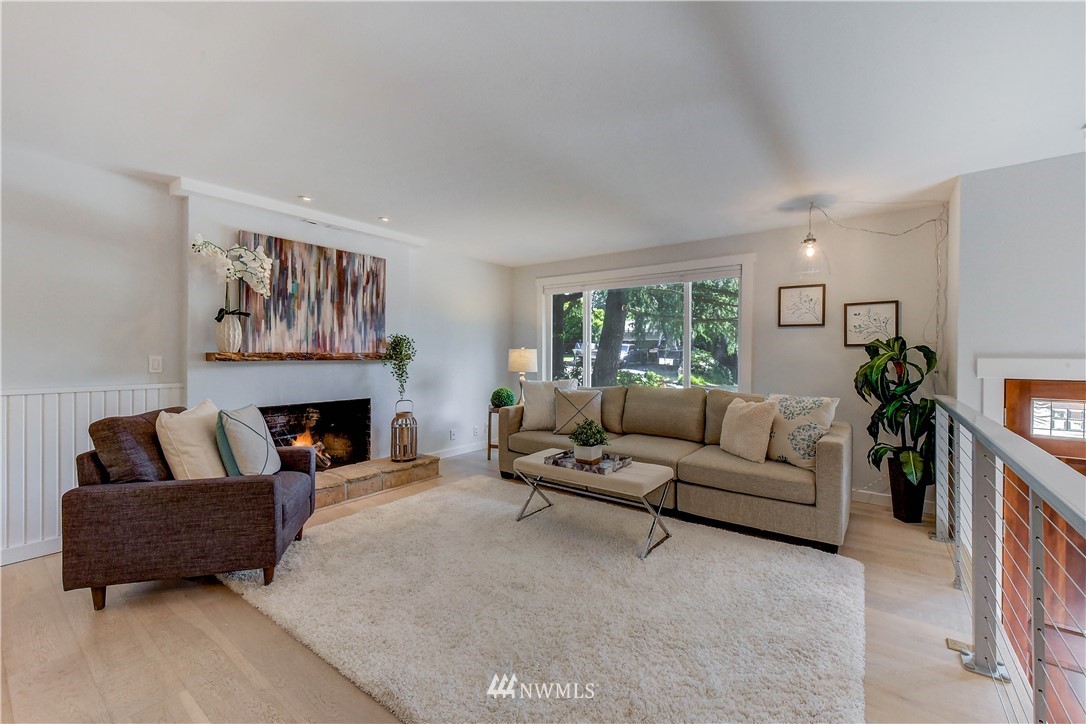 21828 Meridian Avenue South Bothell, WA 98021 - Photo 4 of 31 a living room with furniture and a fireplace