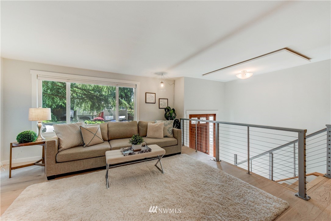 21828 Meridian Avenue South Bothell, WA 98021 - Photo 5 of 31 a living room with furniture and a large window