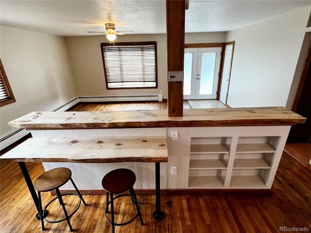 a view of wooden floor and chair in a room