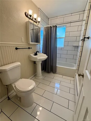 a room with a wooden floor and a walk in closet