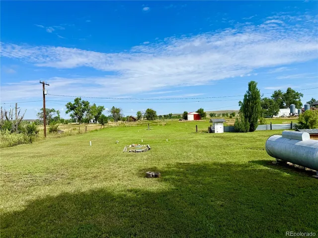 a view of a garden with an ocean