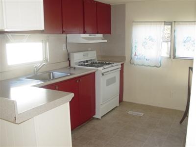 3309 Santa Rosa Avenue, Unit 28 Santa Rosa, CA 95407 - Photo 4 of 8 a kitchen with a sink stove and cabinets