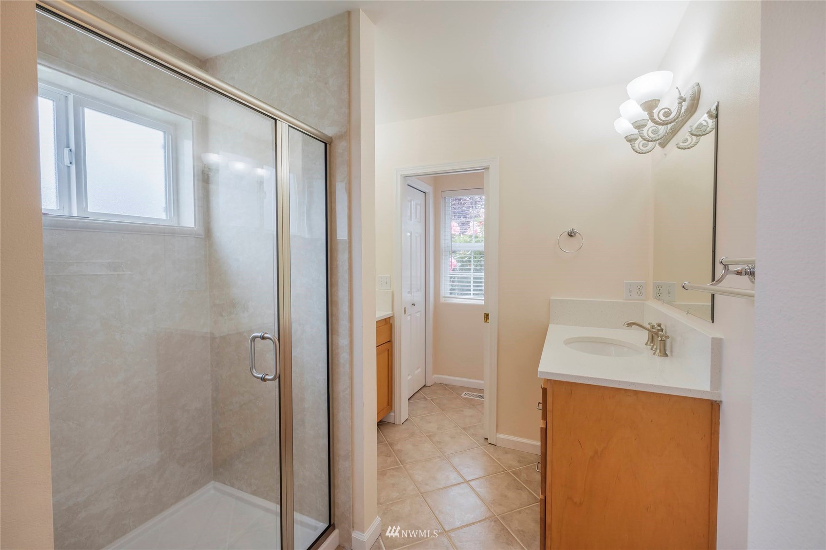 2802 Tracyton Beach Road Northwest Bremerton, WA 98310 - Photo 16 of 40 a bathroom with a sink a toilet and shower