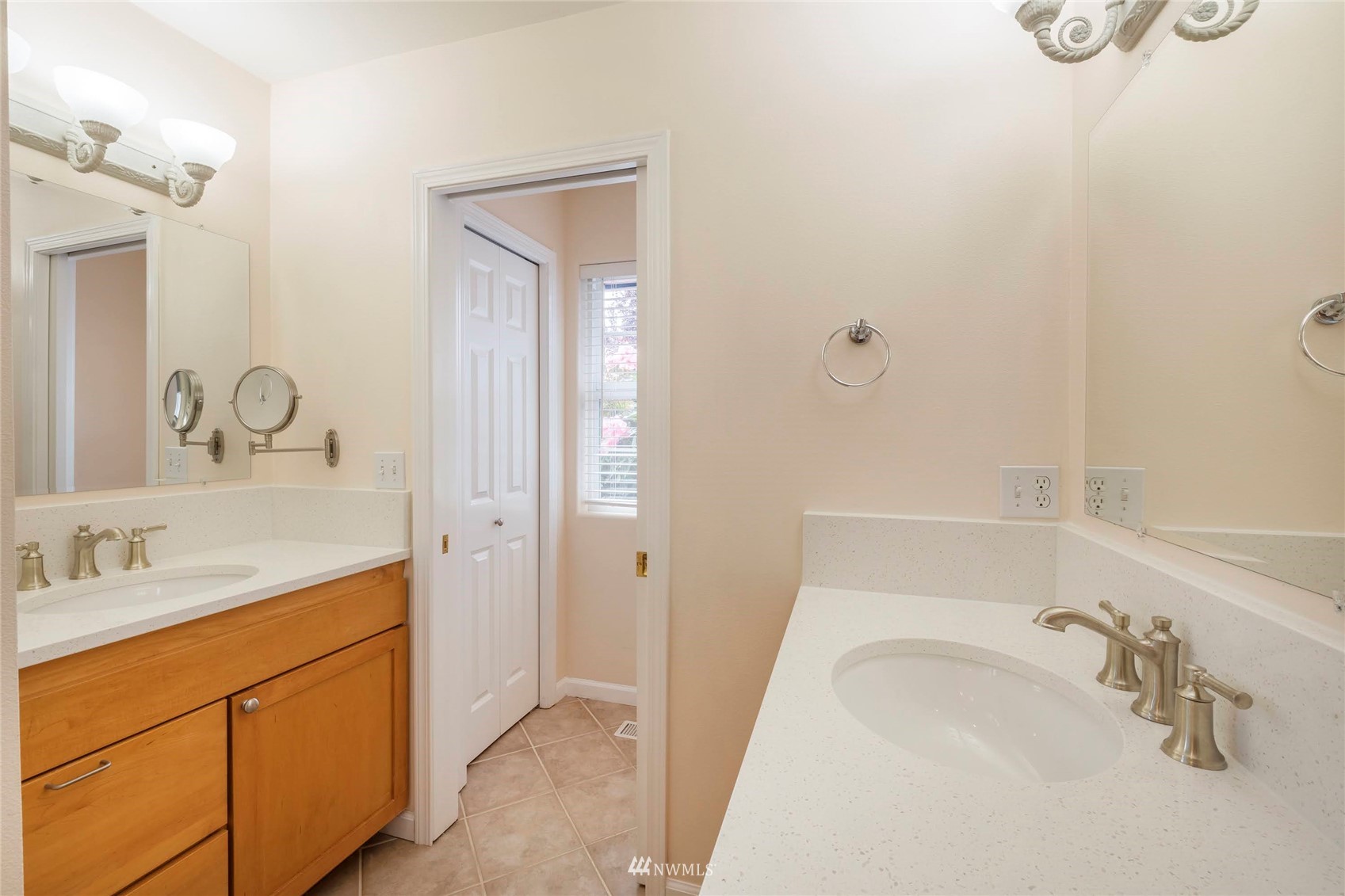 2802 Tracyton Beach Road Northwest Bremerton, WA 98310 - Photo 17 of 40 a bathroom with a granite countertop sink mirror and vanity