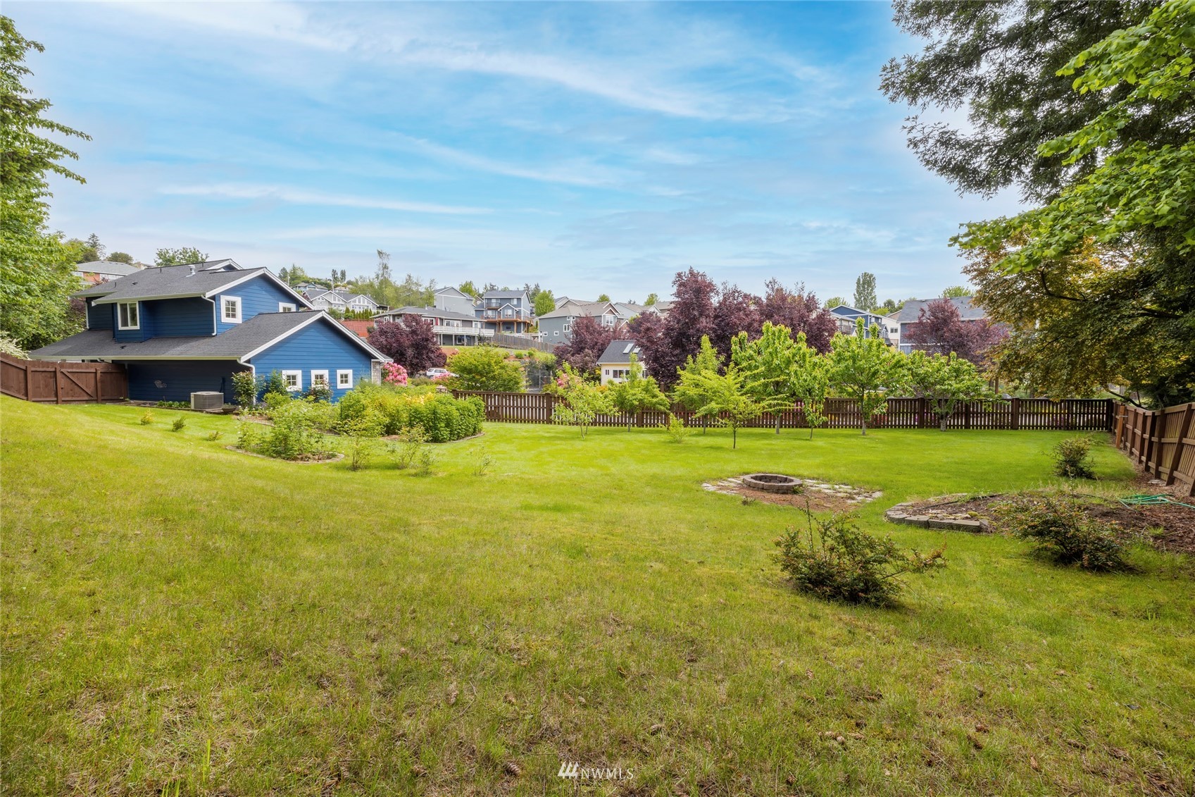 2802 Tracyton Beach Road Northwest Bremerton, WA 98310 - Photo 26 of 40 a view of a house with a big yard and potted plants