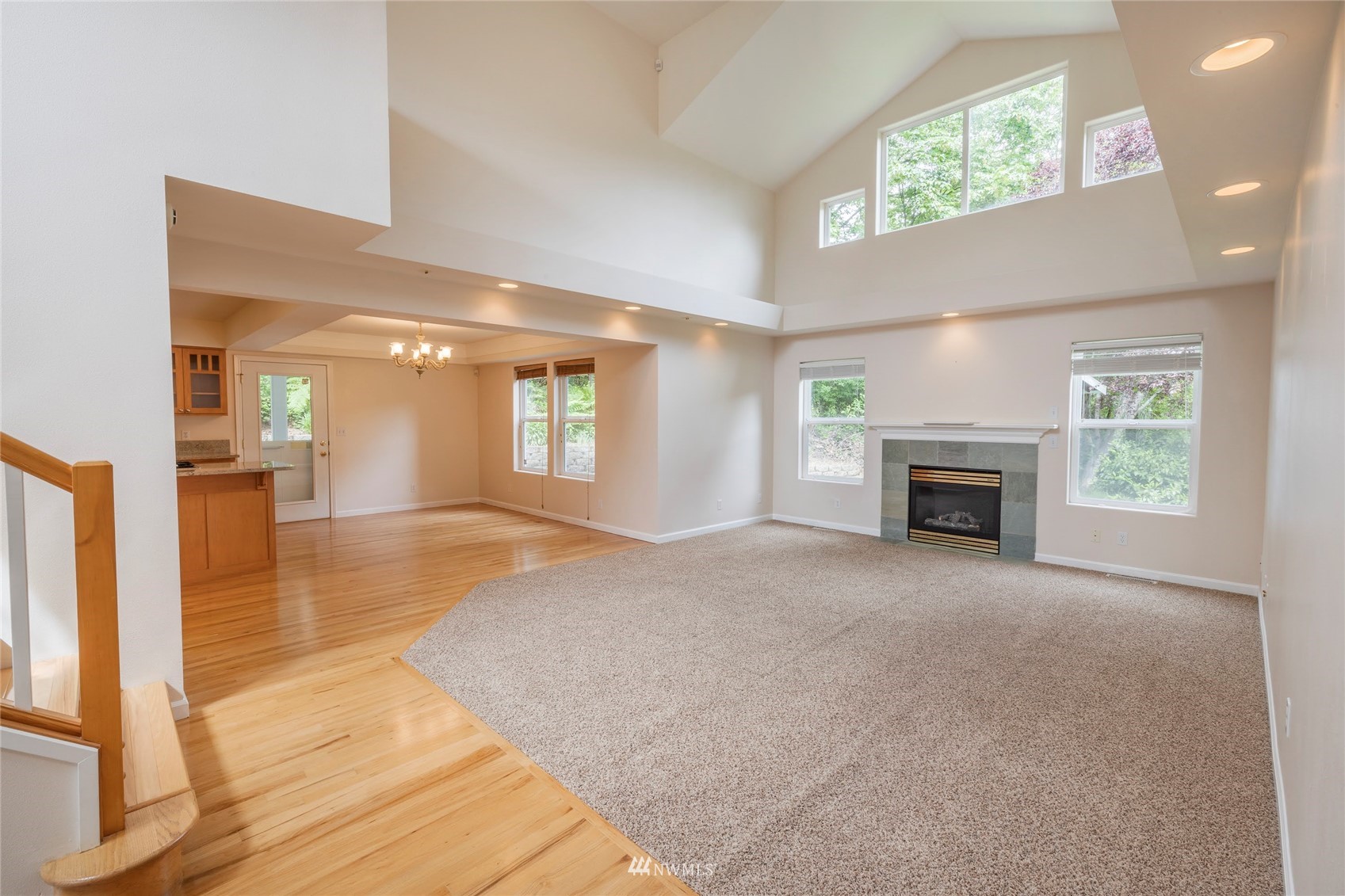 2802 Tracyton Beach Road Northwest Bremerton, WA 98310 - Photo 3 of 40 an empty room with windows and fireplace