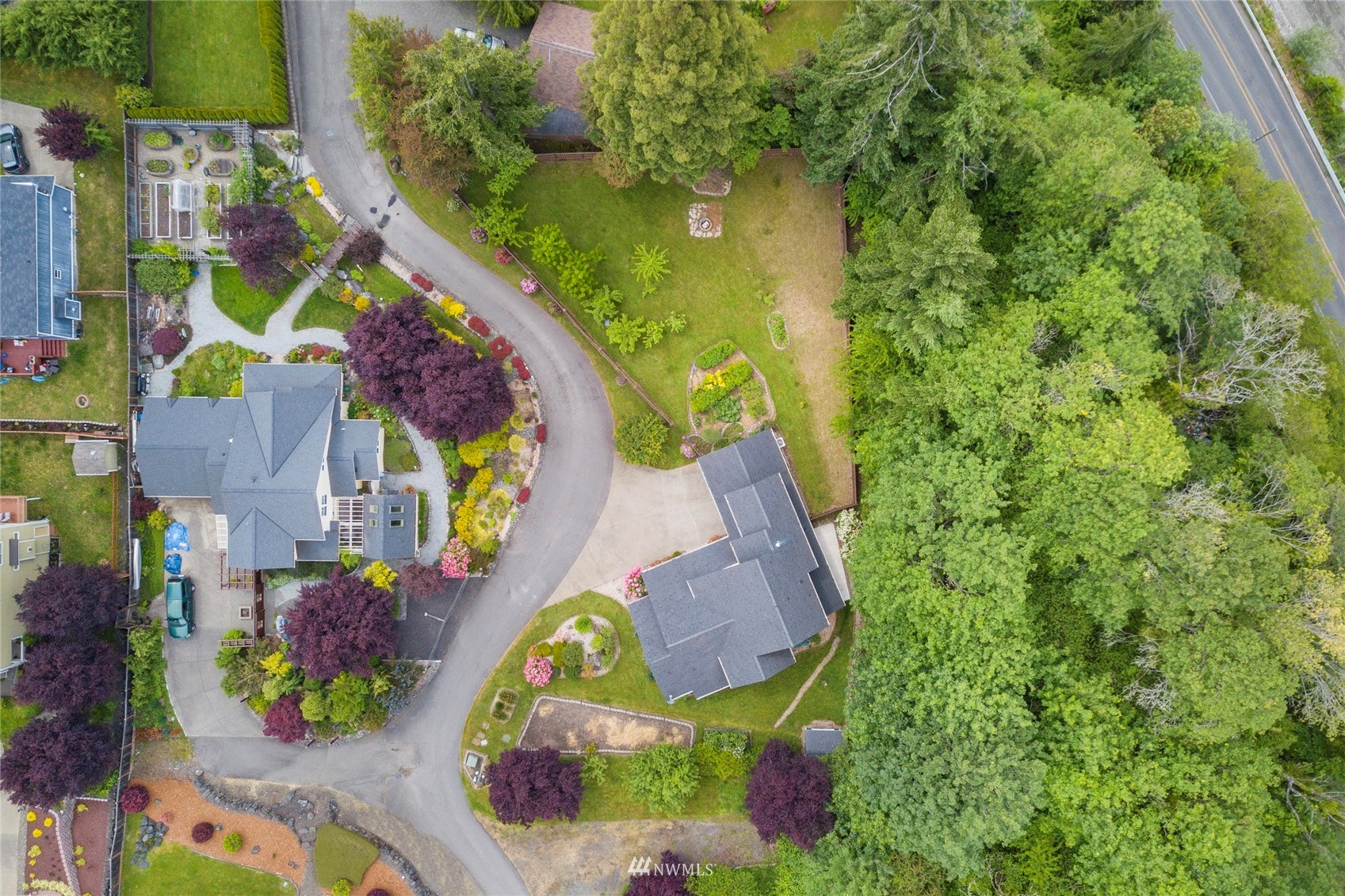 2802 Tracyton Beach Road Northwest Bremerton, WA 98310 - Photo 35 of 40 aerial view of a house with a swimming pool