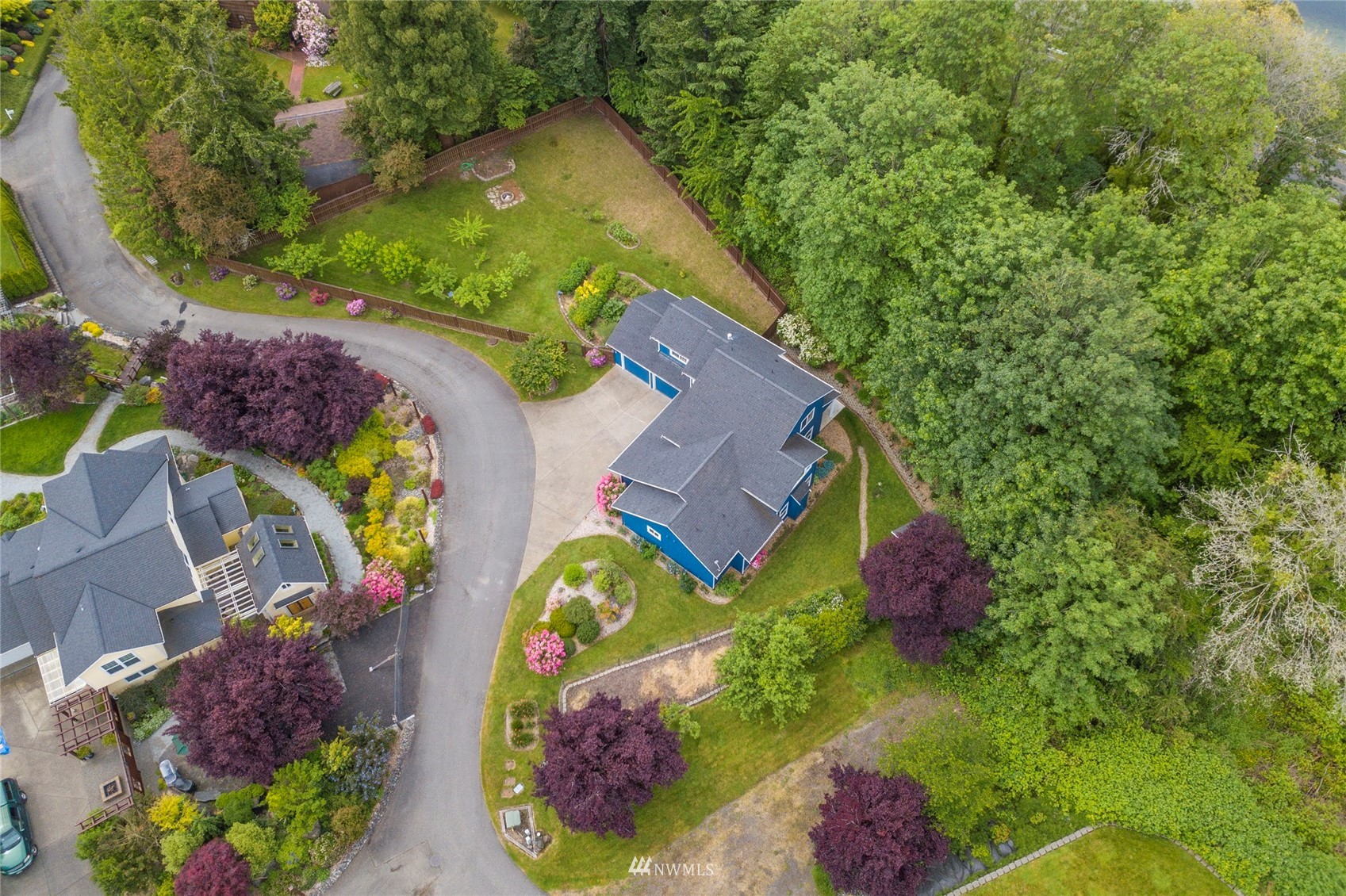 2802 Tracyton Beach Road Northwest Bremerton, WA 98310 - Photo 36 of 40 an aerial view of a house with a yard and large trees