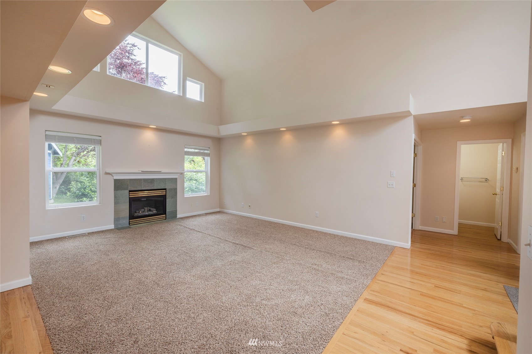 2802 Tracyton Beach Road Northwest Bremerton, WA 98310 - Photo 5 of 40 a view of an empty room with a fireplace and a window