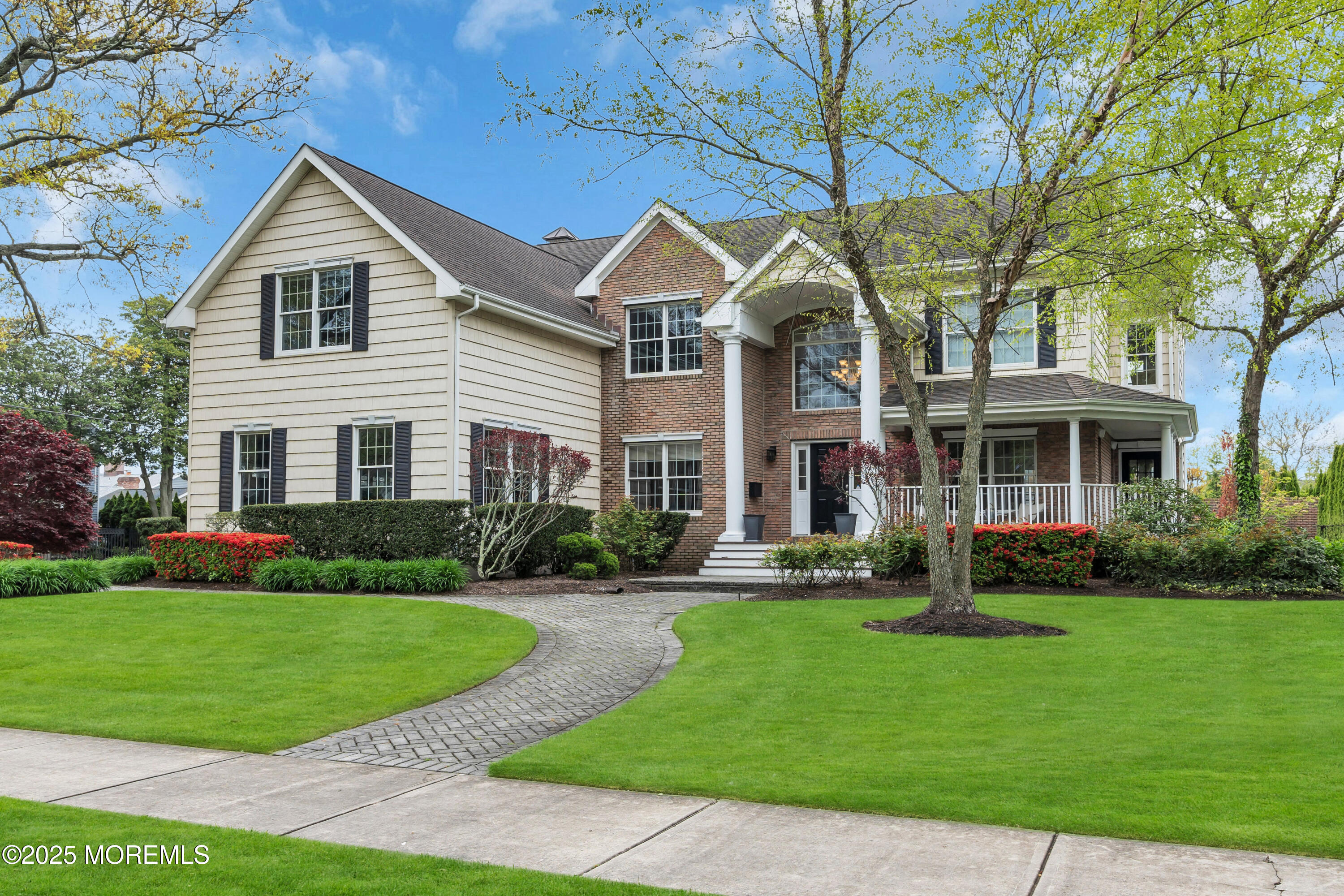 201 Jersey Avenue Spring Lake, NJ 07762 - Photo 1 of 29 a front view of a house with a garden and trees