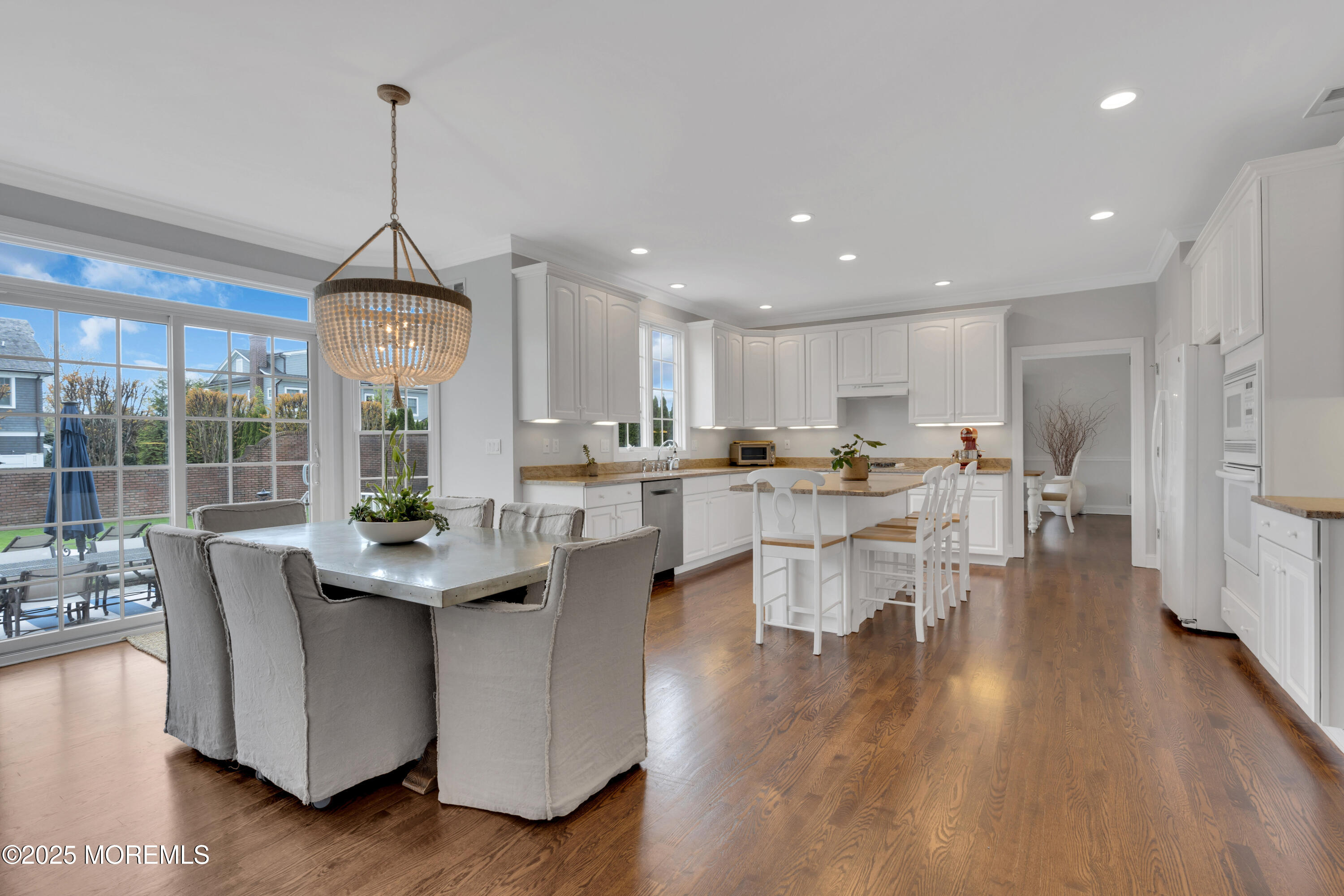 201 Jersey Avenue Spring Lake, NJ 07762 - Photo 12 of 29 a living room with stainless steel appliances kitchen island granite countertop furniture and a wooden floor