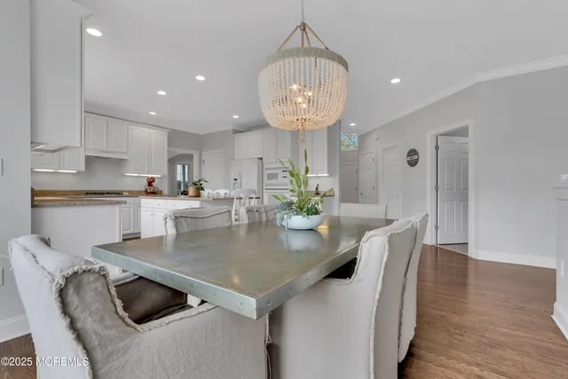 a view of kitchen and dining room with wooden floor