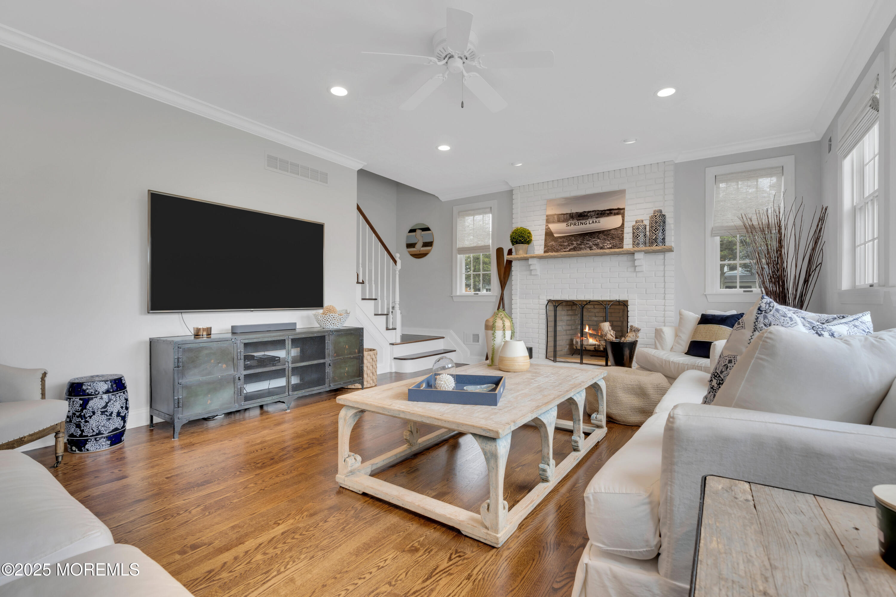 201 Jersey Avenue Spring Lake, NJ 07762 - Photo 15 of 29 a living room with furniture and a flat screen tv