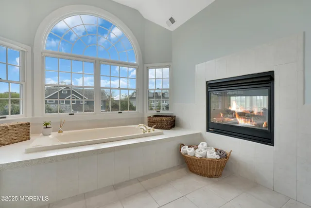 a bathroom with a bathtub and window