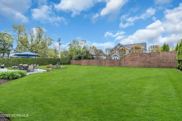 a view of yard with grass and a trees