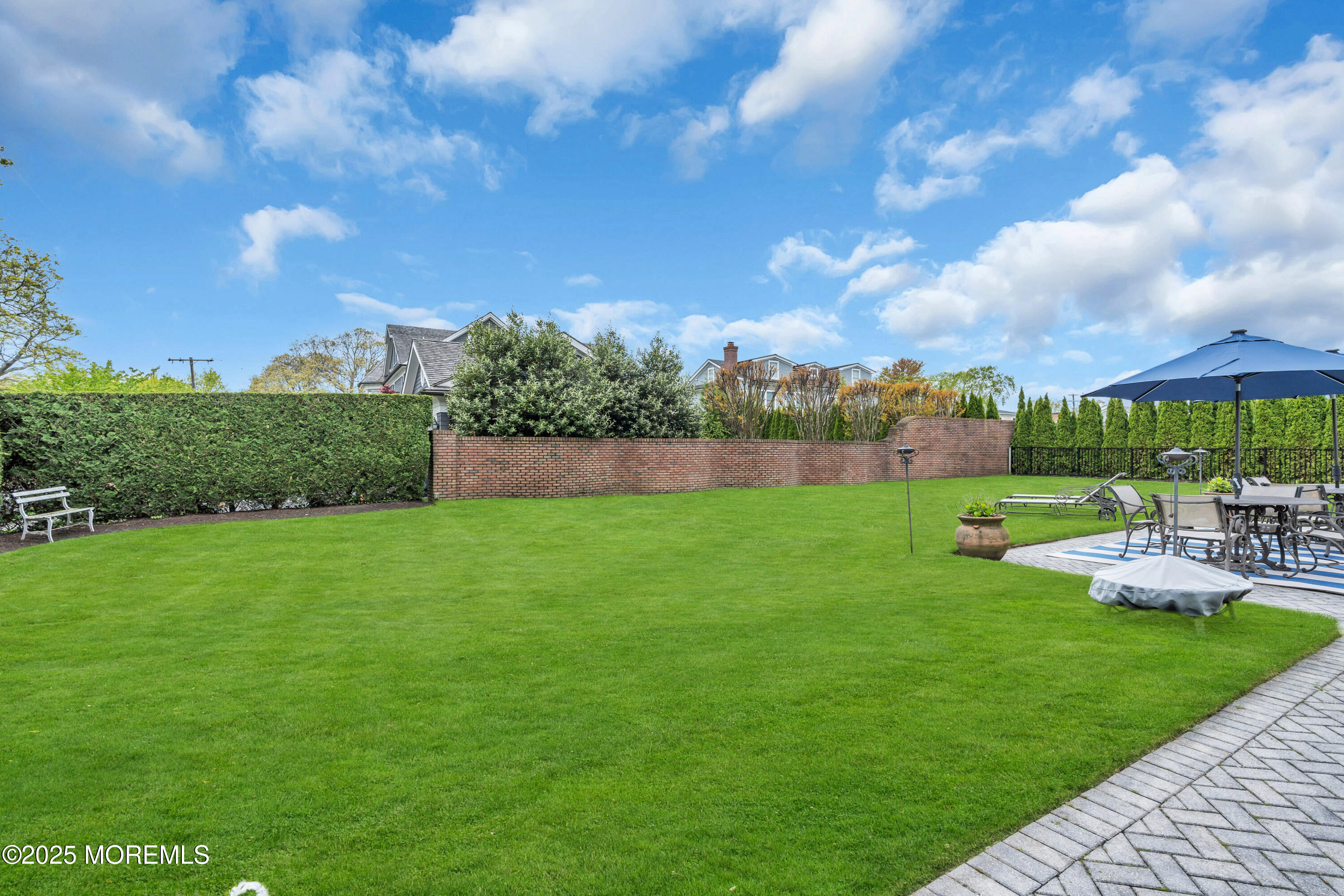 201 Jersey Avenue Spring Lake, NJ 07762 - Photo 5 of 29 a view of yard with swimming pool and green space