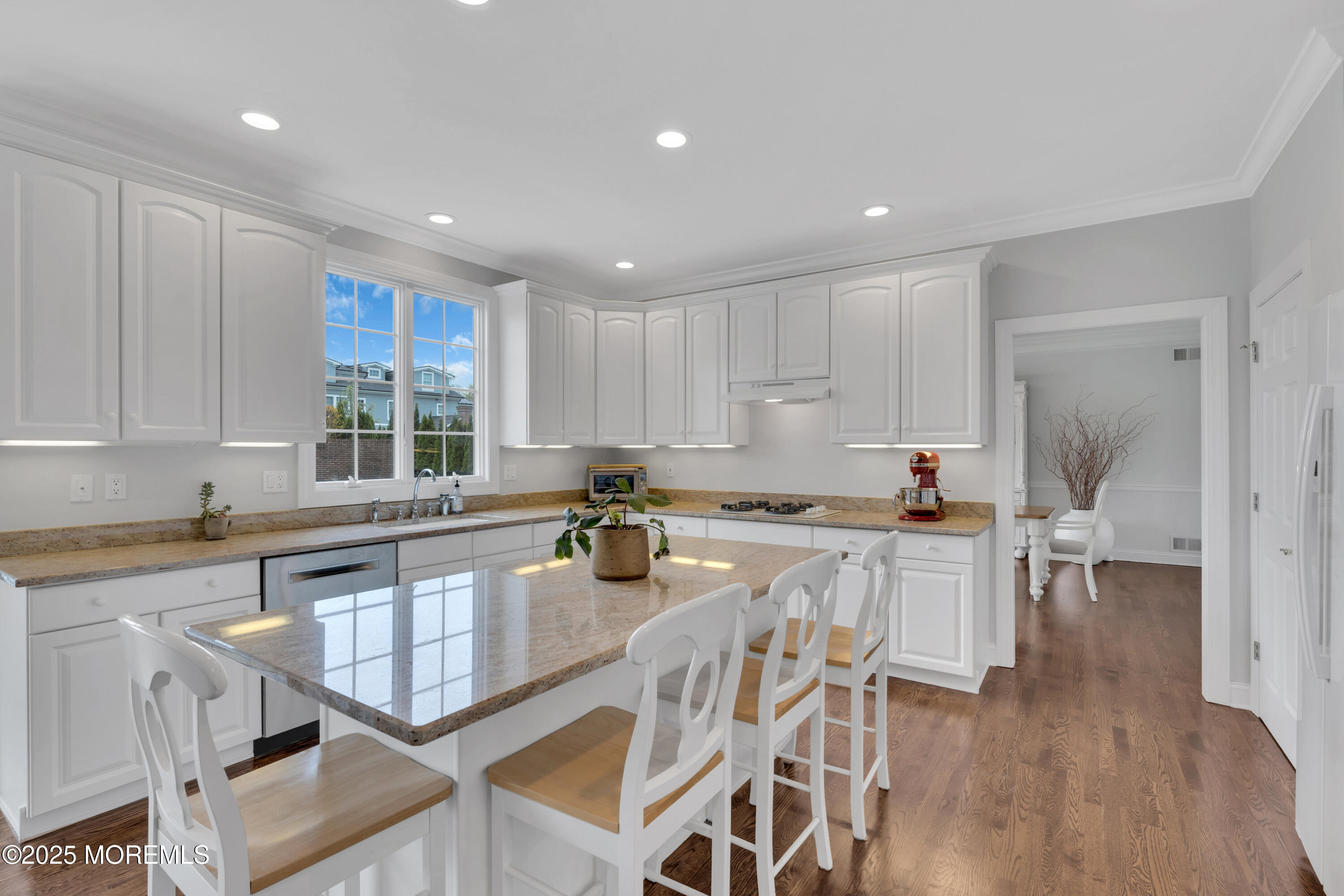 201 Jersey Avenue Spring Lake, NJ 07762 - Photo 9 of 29 an open kitchen with granite countertop white cabinets and stainless steel appliances