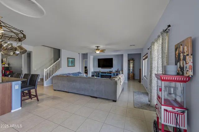 a very nice looking room with a large window and a chandelier
