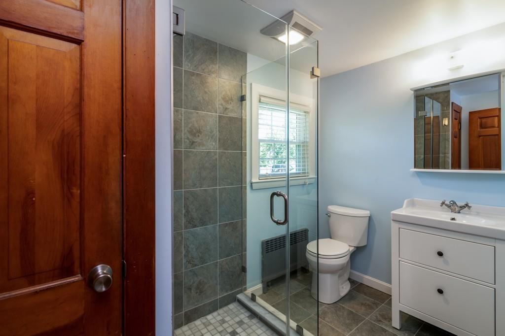 122 Edgewater Road Hull, MA 02045 - Photo 13 of 24 a bathroom with a toilet a sink and shower