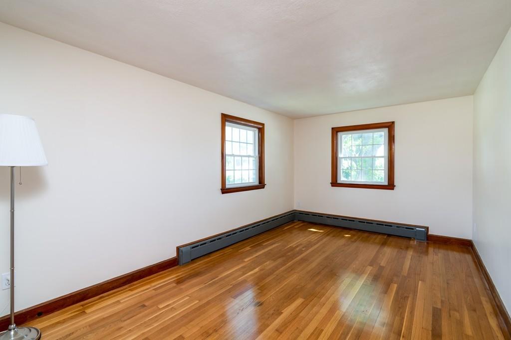 122 Edgewater Road Hull, MA 02045 - Photo 14 of 24 a view of a room with wooden floor and window