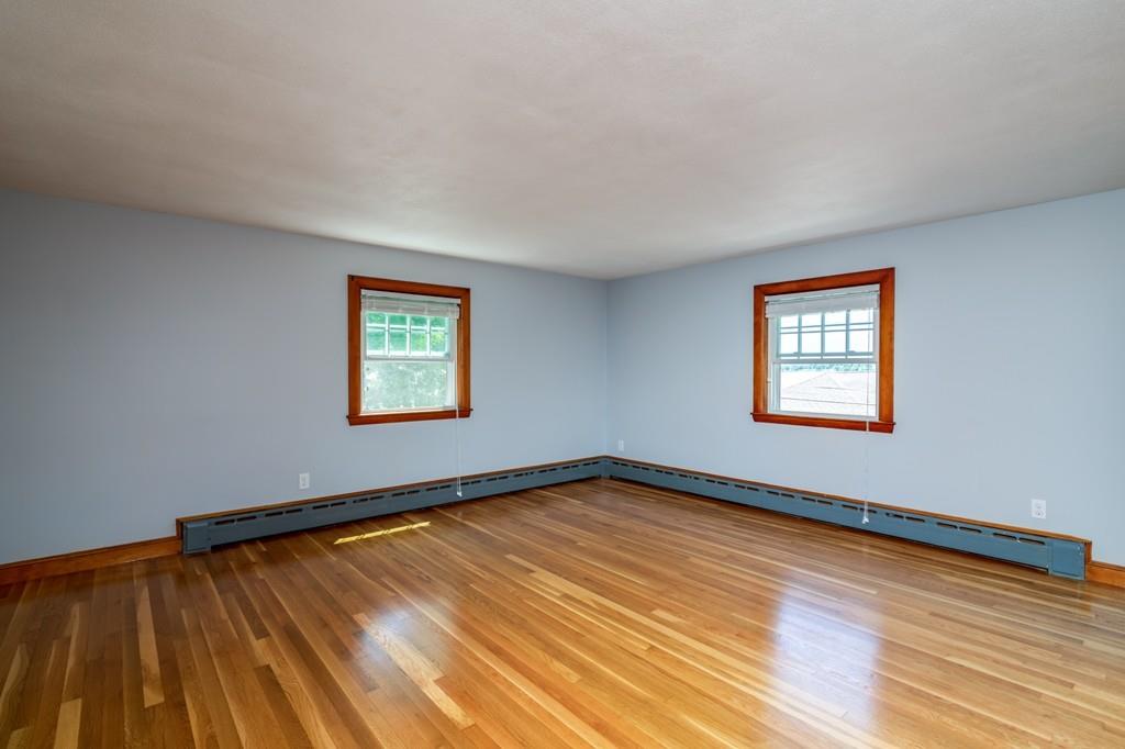 122 Edgewater Road Hull, MA 02045 - Photo 15 of 24 a view of a room with wooden floor and windows