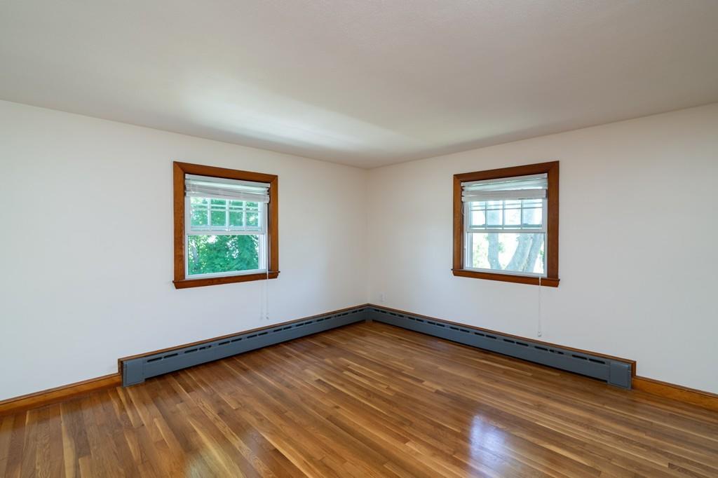 122 Edgewater Road Hull, MA 02045 - Photo 19 of 24 a view of a room with wooden floor and window