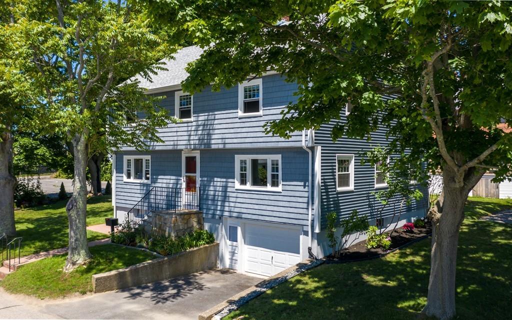 122 Edgewater Road Hull, MA 02045 - Photo 2 of 24 a front view of a house with a garden