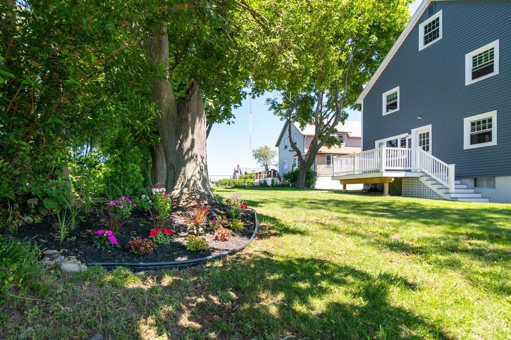 122 Edgewater Road Hull, MA 02045 - Photo 22 of 24 a view of a house with a big yard and large trees