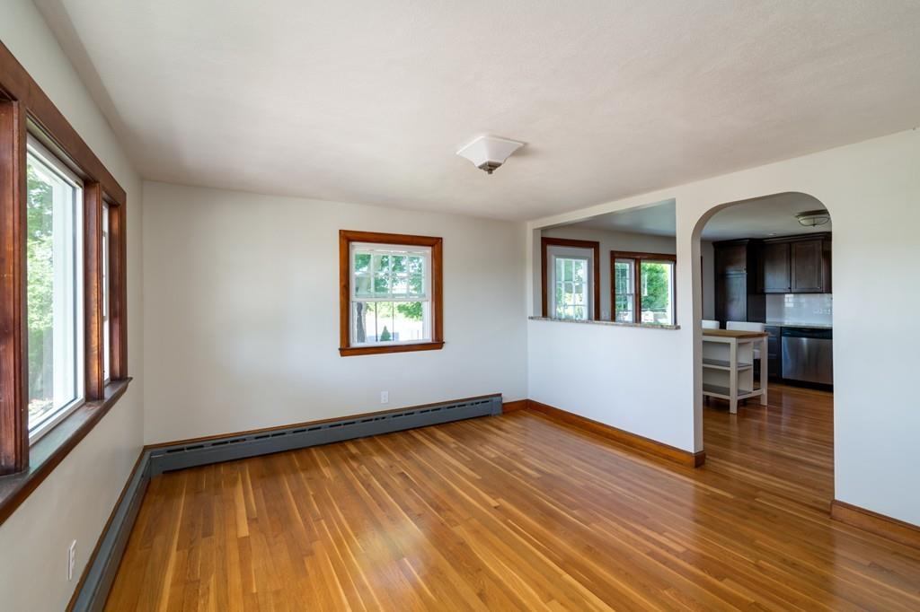 122 Edgewater Road Hull, MA 02045 - Photo 8 of 24 wooden floor in an empty room with a window