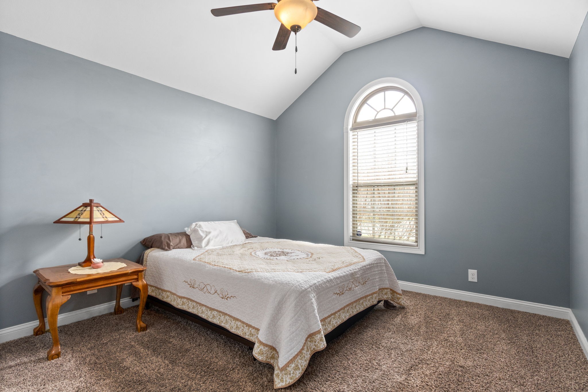 3784 Suiter Road Clarksville, TN 37040 - Photo 24 of 28 a bedroom with a bed and a chandelier