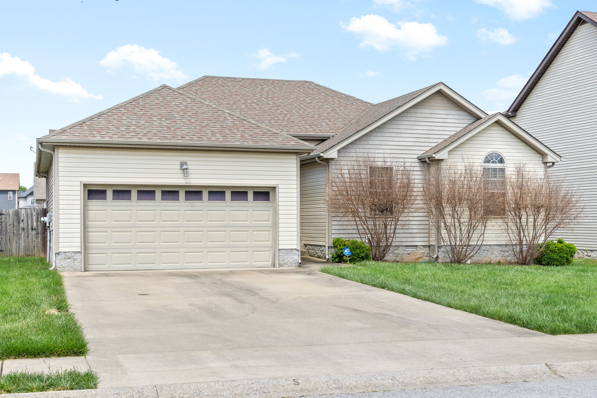 3784 Suiter Road Clarksville, TN 37040 - Photo 3 of 28 a front view of a house with a yard and garage