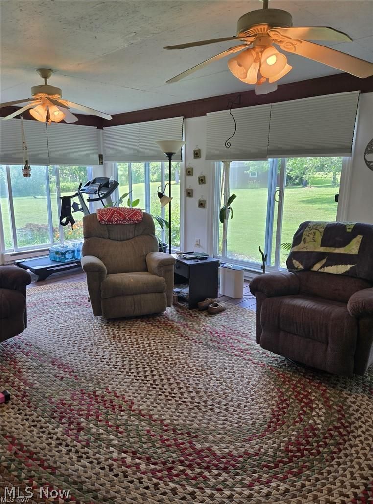 14640 Stone Road Newbury, OH 44065 - Photo 14 of 19 The sunroom has walls of windows