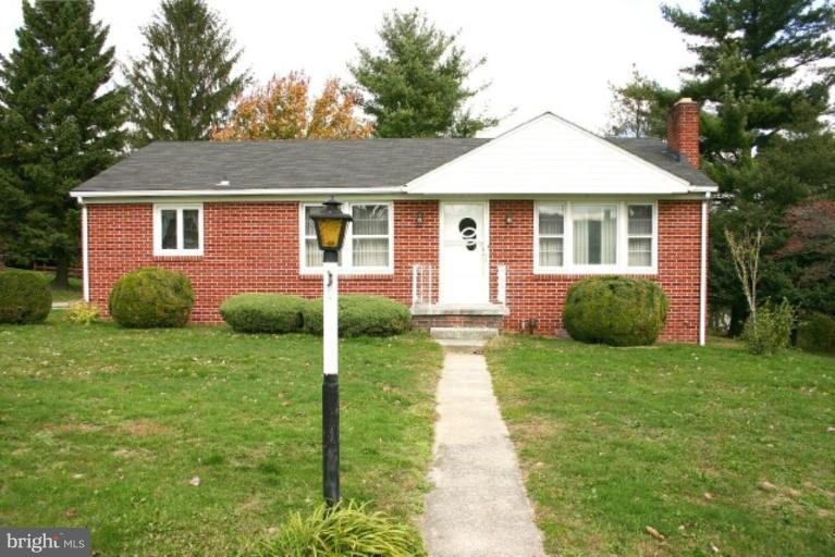 4206 Hunter Road South Hampstead, MD 21074 - Photo 1 of 4 a view of a house with a yard and potted plants